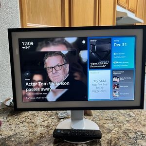 Like new Amazon Echo Show 15  with Stand Swivel and tilt and remote control.